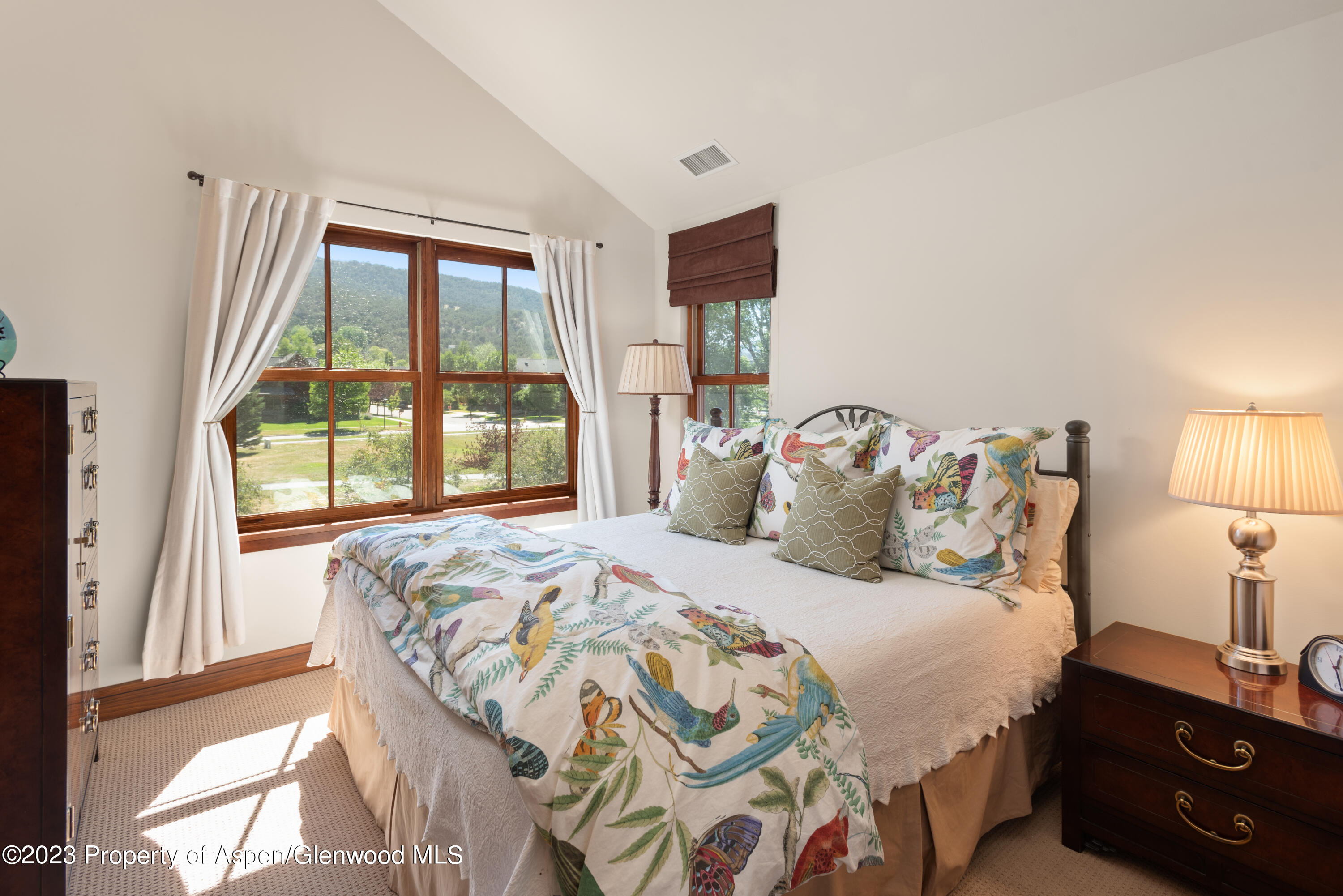346 Sopris Circle Basalt, CO 81621 - Photo 18 of 25 a bedroom with a bed and a window