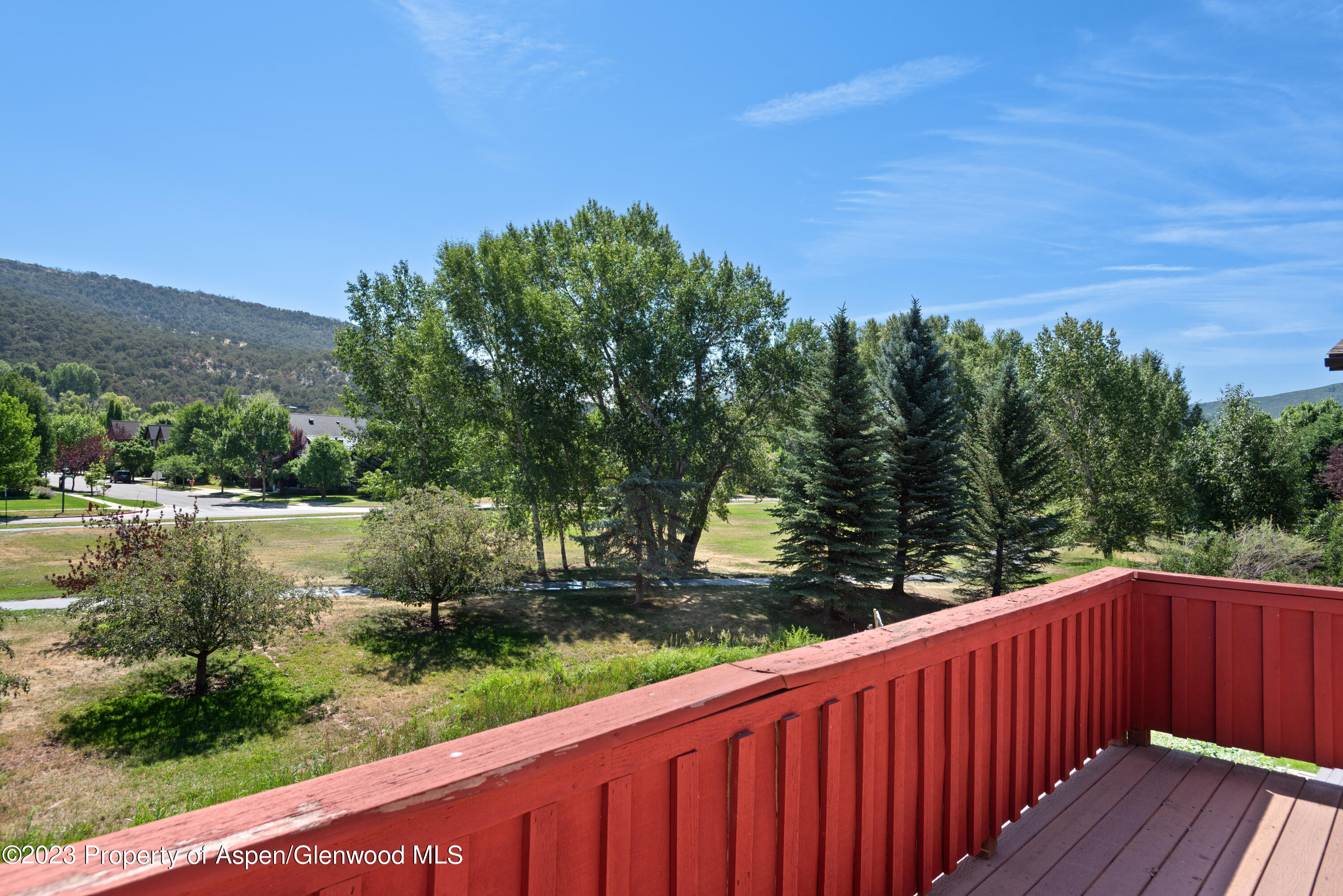 346 Sopris Circle Basalt, CO 81621 - Photo 9 of 25 a backyard of a house with lots of green space and mountain view in back
