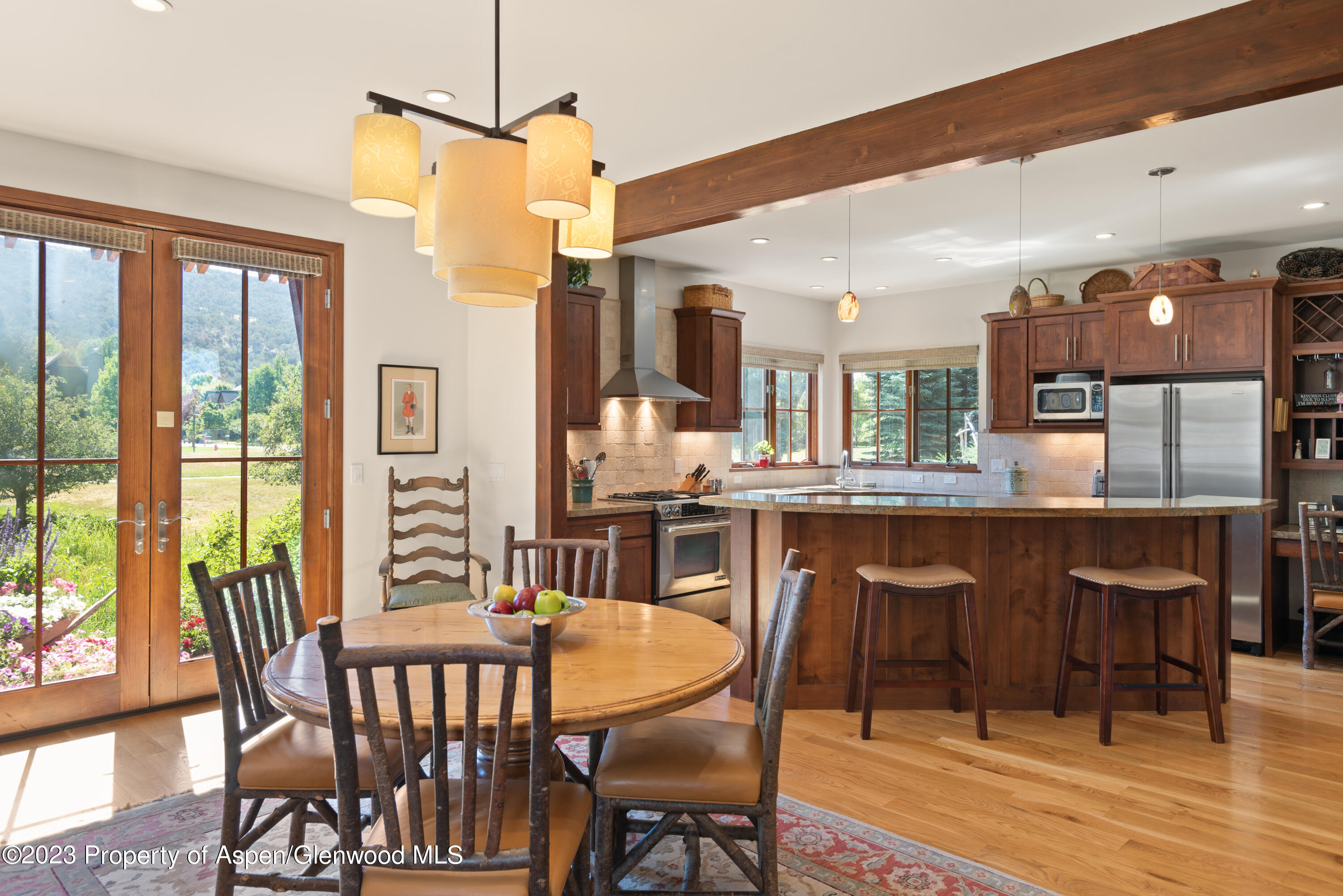 346 Sopris Circle Basalt, CO 81621 - Photo 10 of 25 a dining room with furniture and wooden floor