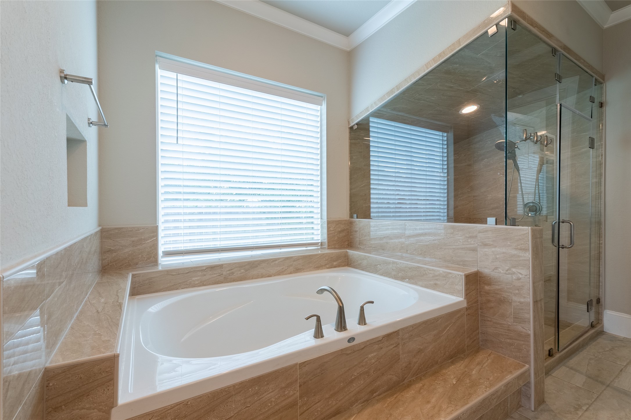 25718 Muirfield Bend Court Spring, TX 77389 - Photo 24 of 50 a bathroom with a bathtub and shower