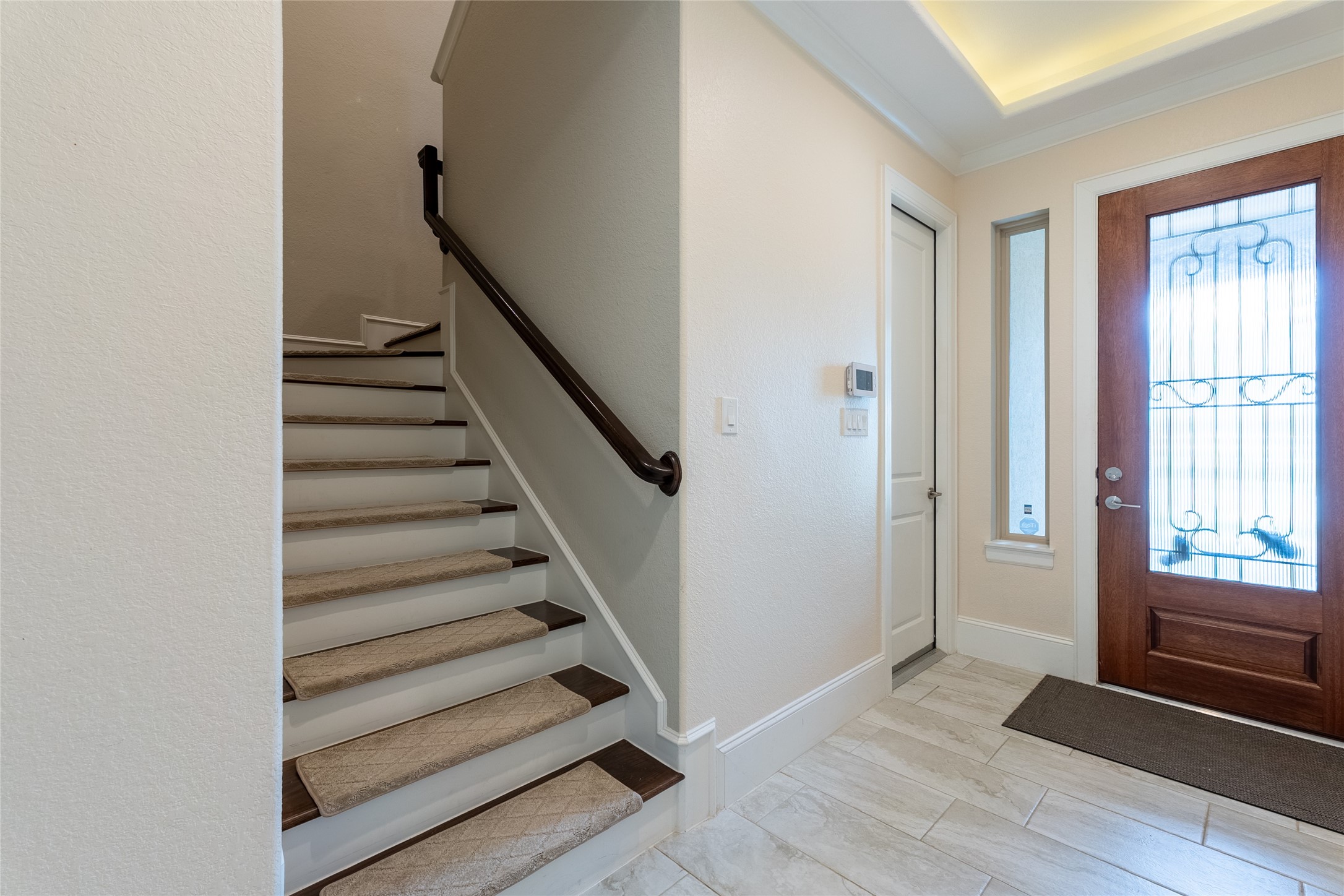 25718 Muirfield Bend Court Spring, TX 77389 - Photo 25 of 50 a view of entryway with wooden floor and stairs