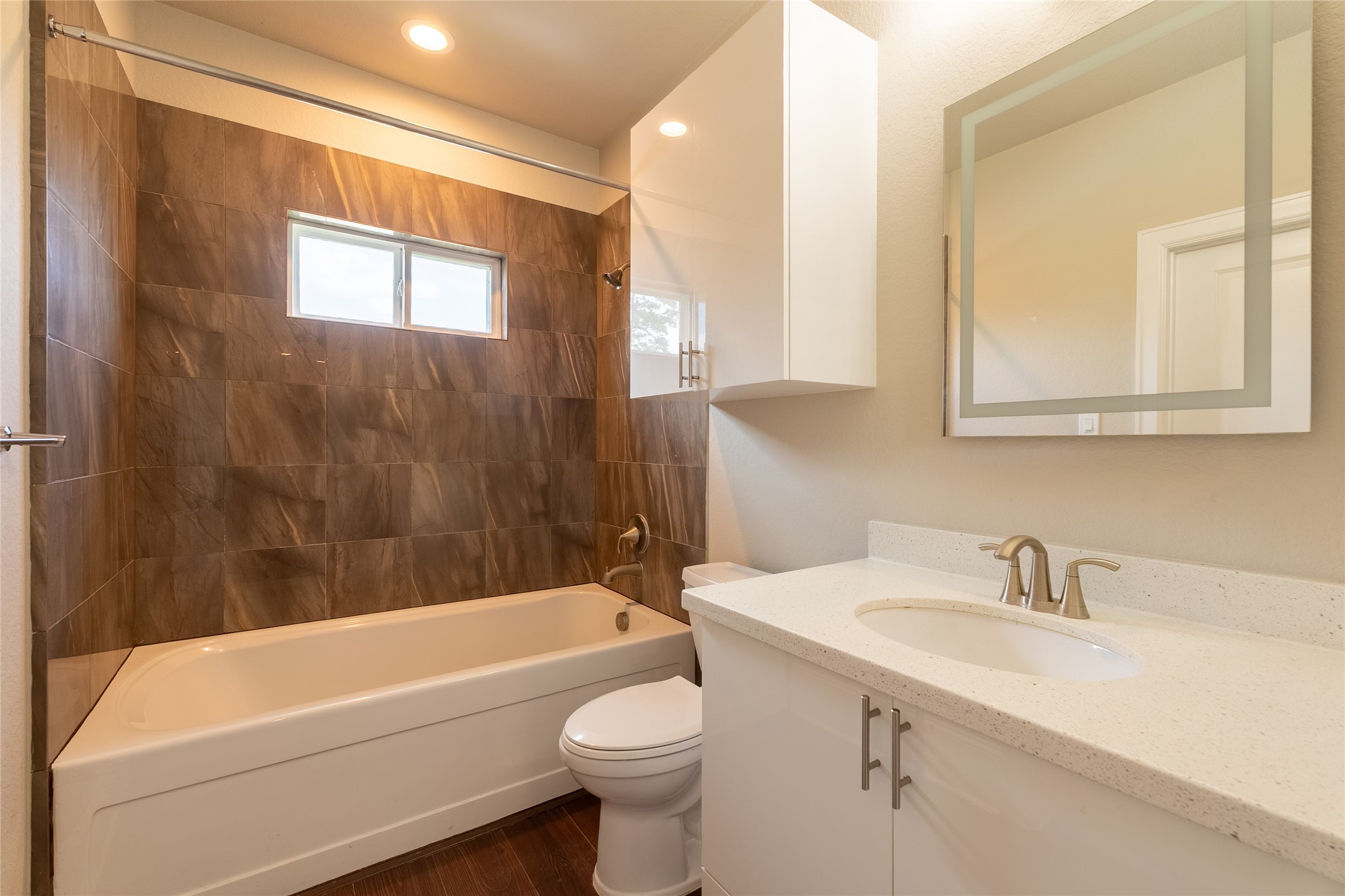 25718 Muirfield Bend Court Spring, TX 77389 - Photo 28 of 50 a bathroom with a sink a toilet and bathtub