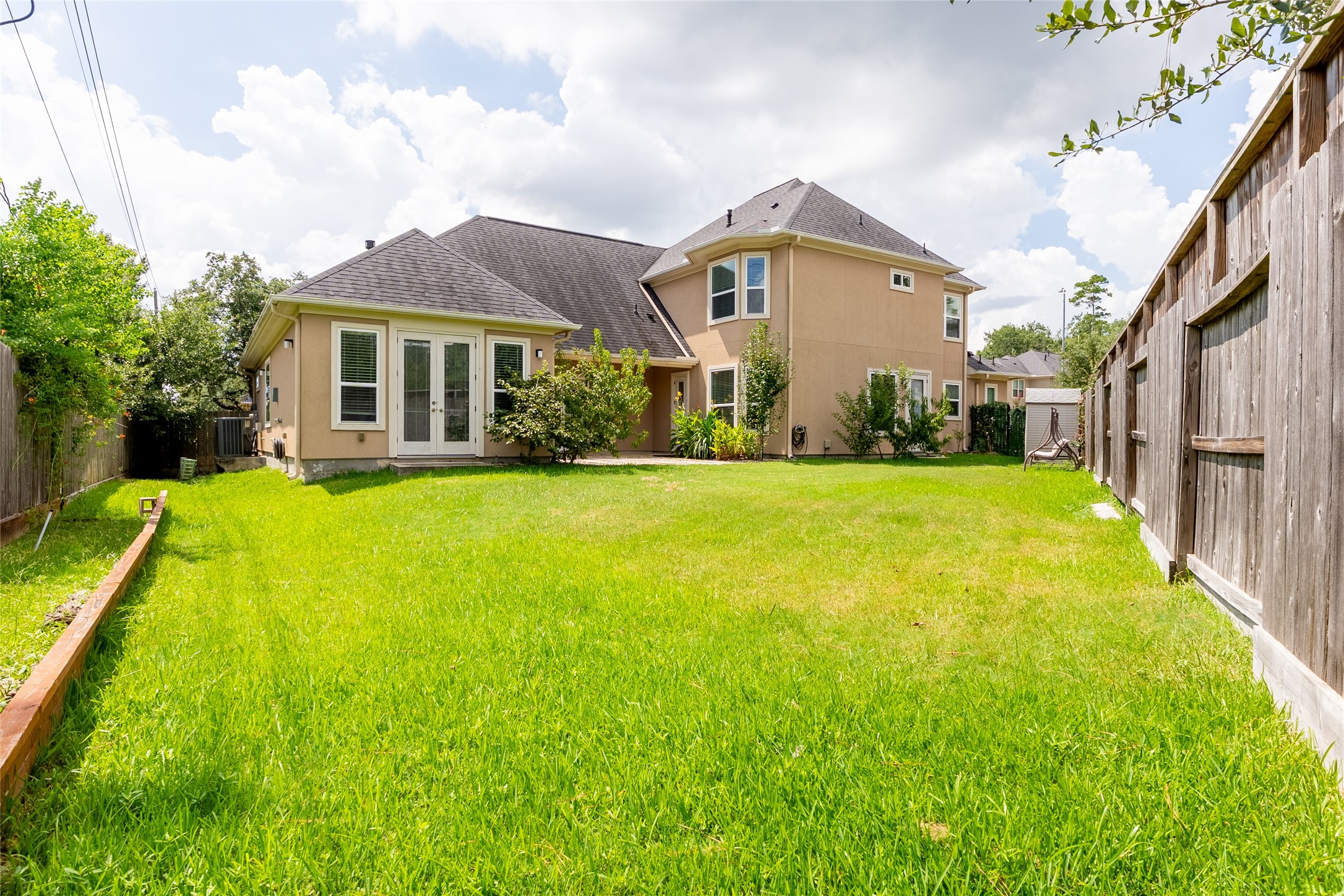 25718 Muirfield Bend Court Spring, TX 77389 - Photo 41 of 50 a view of a house with a big yard and potted plants