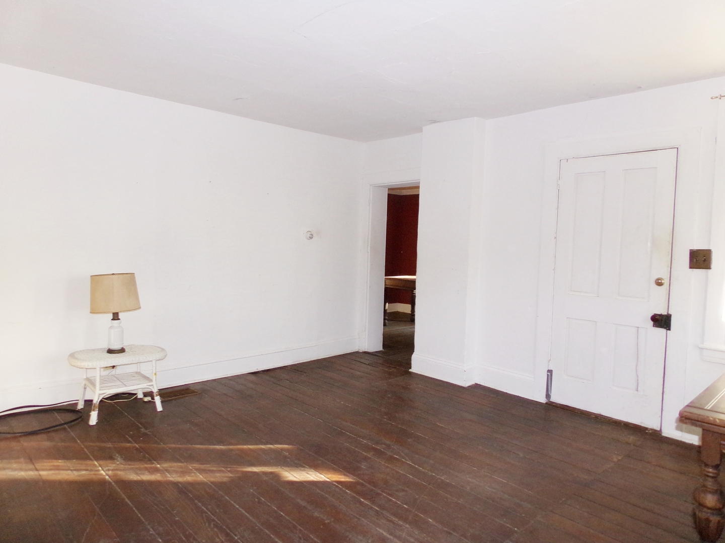 N955 Pouley Road Elburn, IL 60119 - Photo 12 of 23 a view of an empty room with wooden floor and a cabinet