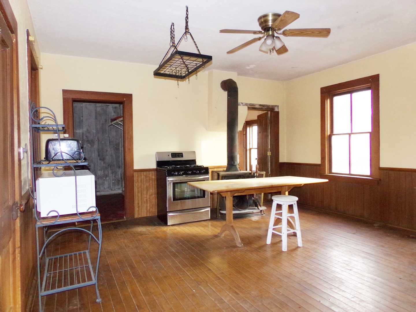 N955 Pouley Road Elburn, IL 60119 - Photo 5 of 23 a work room with chandelier fan and wooden floor