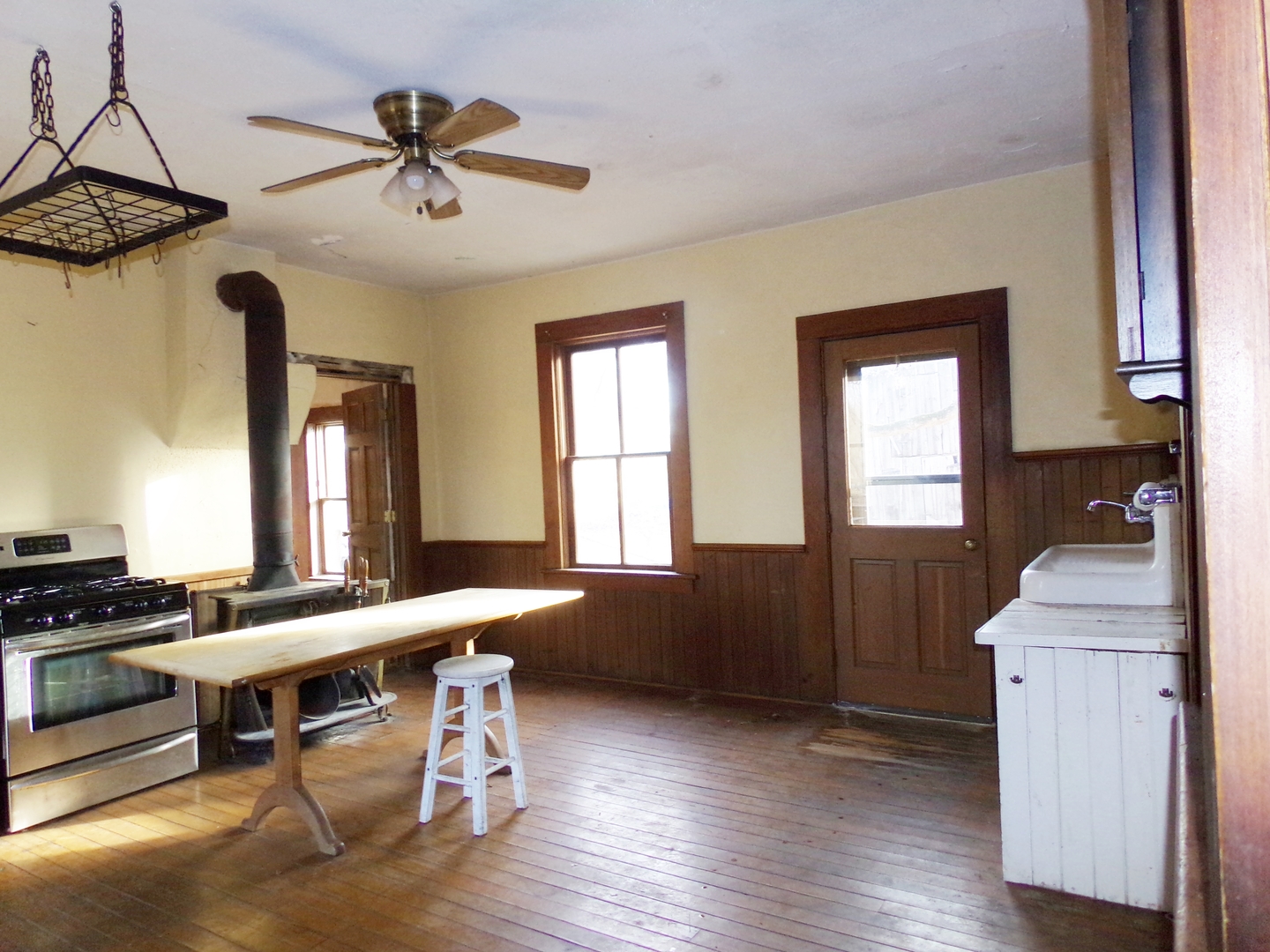 N955 Pouley Road Elburn, IL 60119 - Photo 6 of 23 a kitchen with a table chairs a stove and a window