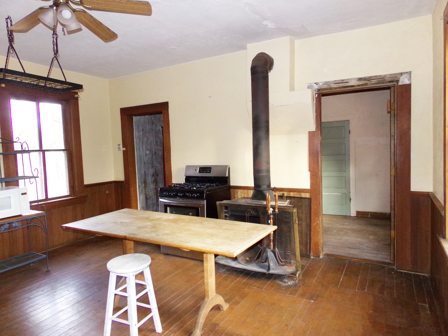 N955 Pouley Road Elburn, IL 60119 - Photo 8 of 23 a view of a dining room with furniture and wooden floor