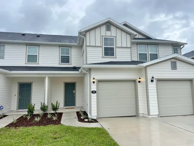 a kitchen that has a sink and a stove in it
