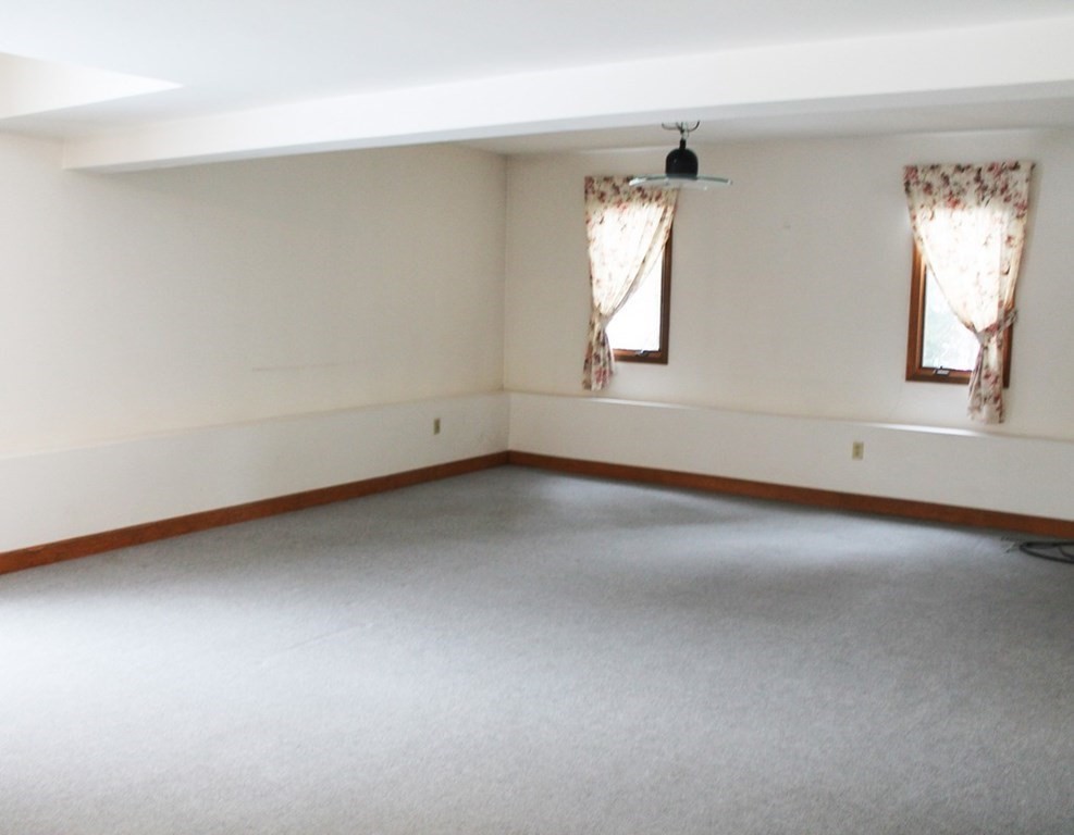 234 Davis Road Bedford, MA 01730 - Photo 19 of 34 an empty room with windows