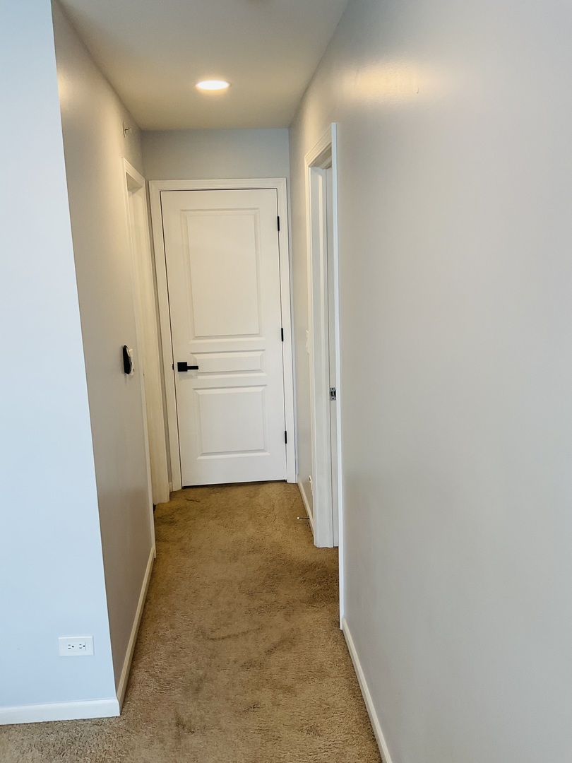 2425 Birch Street Des Plaines, IL 60018 - Photo 24 of 40 a view of a hallway with wooden floor