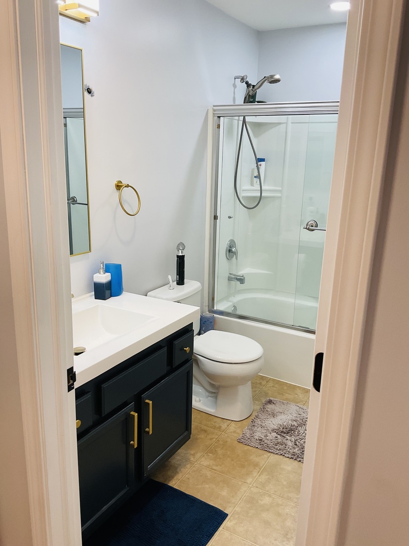 2425 Birch Street Des Plaines, IL 60018 - Photo 28 of 40 a bathroom with a granite countertop sink toilet and shower