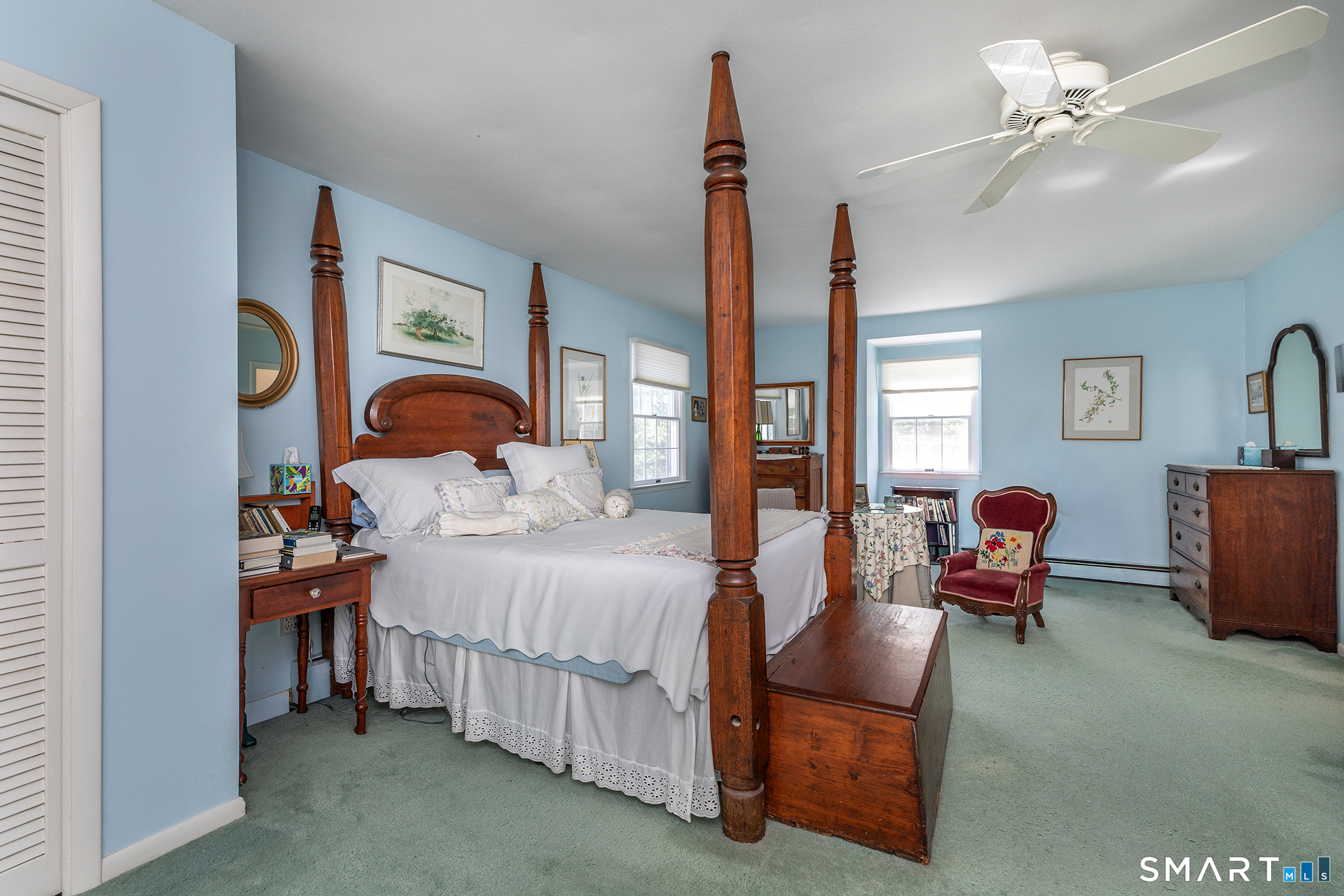 318 Romford Road Washington, CT 06777 - Photo 25 of 34 a bedroom with furniture and a chandelier