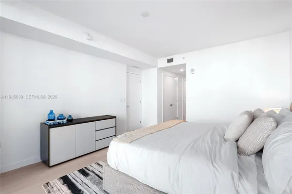 a bathroom with a shower sink and mirror