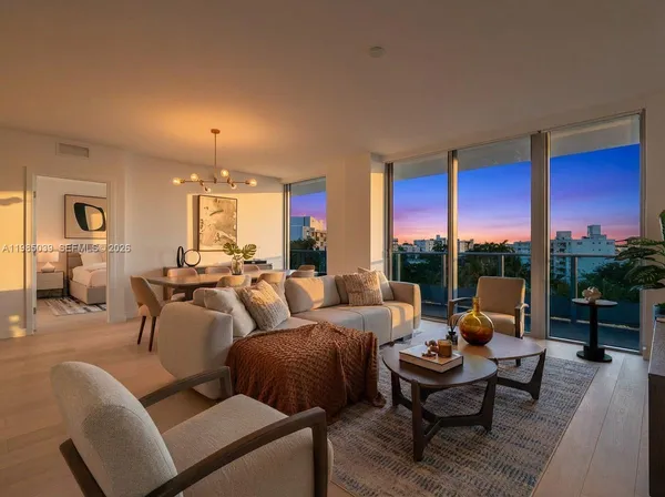 a living room with furniture and a large window