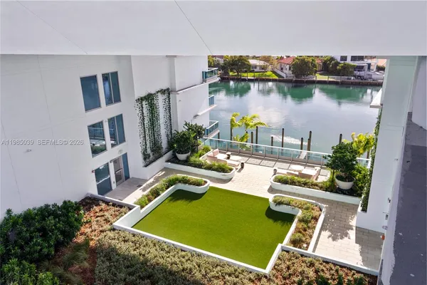 a view of a chair and tables in the backyard