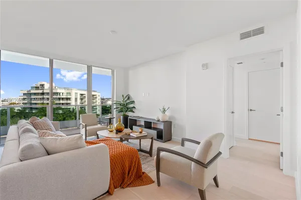 a view of a livingroom with furniture and window