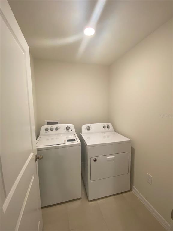 308 Hickory Course Radiel Ocala, FL 34472 - Photo 22 of 24 a utility room with dryer and washer