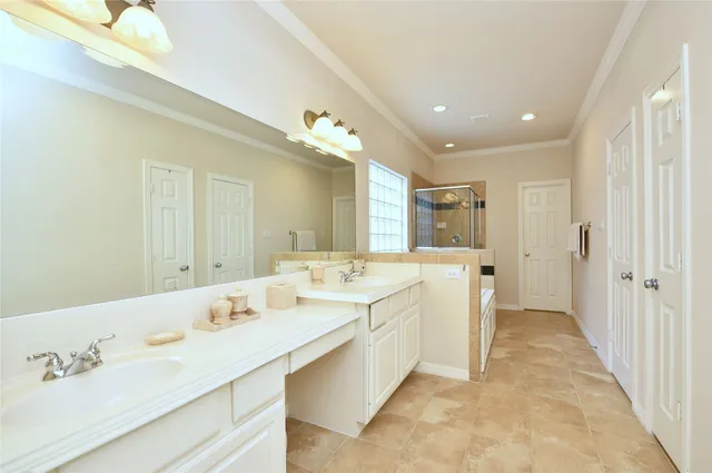 a large bathroom with a double vanity sink and a mirror
