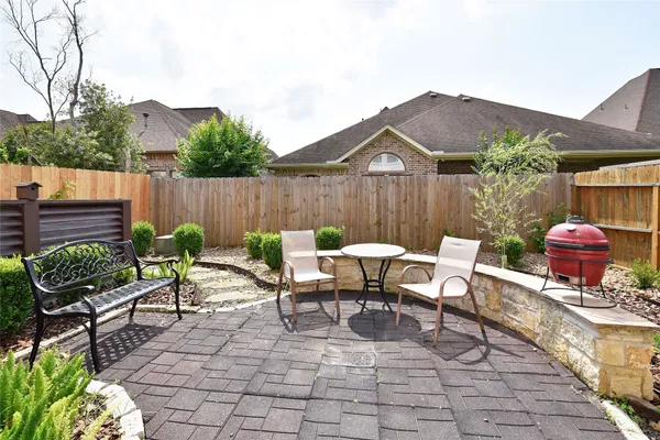 a view of a table and chairs in patio