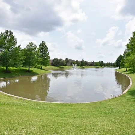 a view of a lake with a big yard
