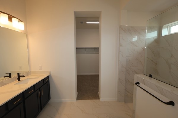 322 Big Pne Trail Rosenberg, TX 77471 - Photo 5 of 14 a bathroom with a double vanity sink and mirror