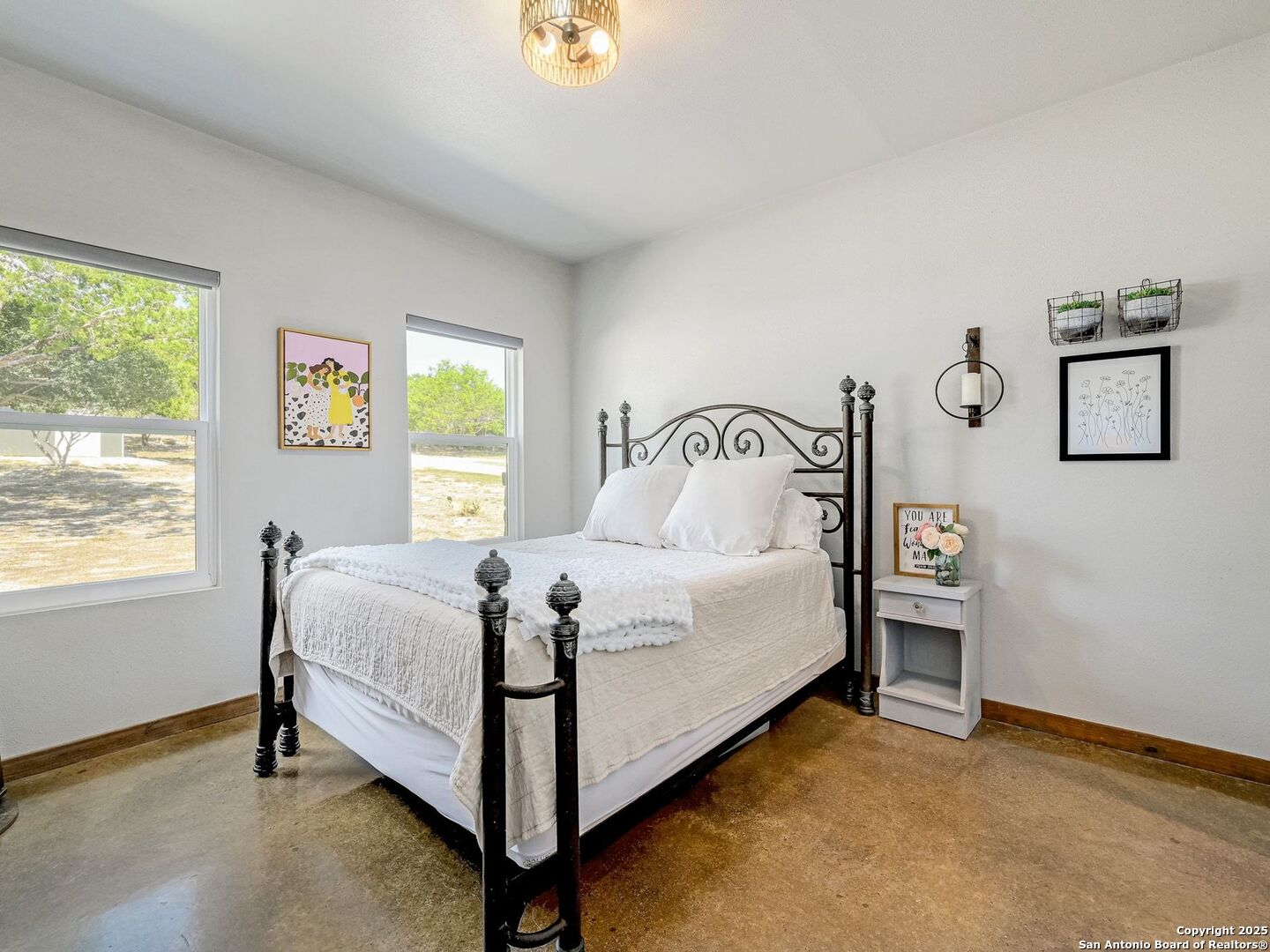 6766 Spring Branch Road Spring Branch, TX 78070 - Photo 22 of 63 a bedroom with a bed and window