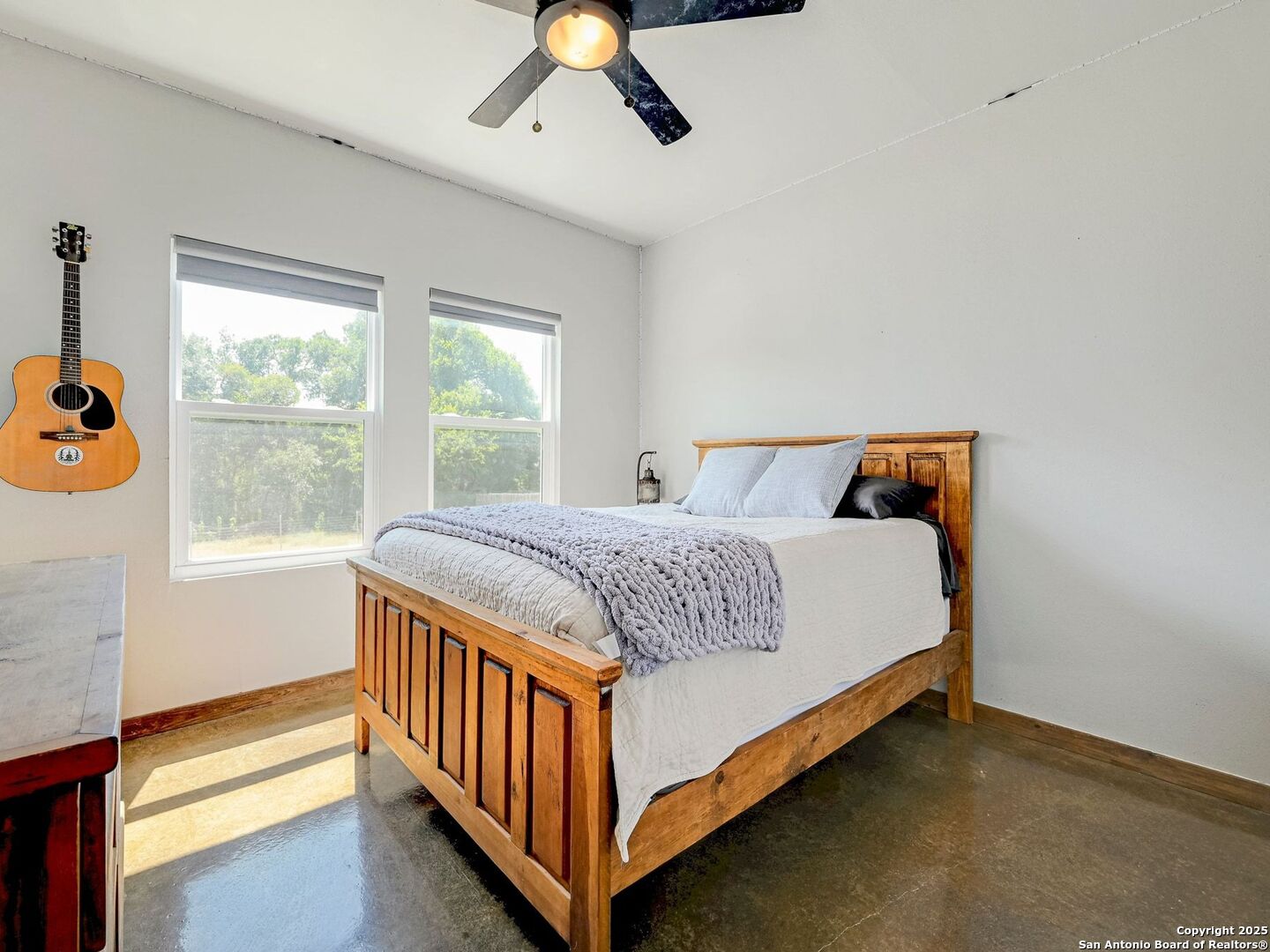 6766 Spring Branch Road Spring Branch, TX 78070 - Photo 25 of 63 a bedroom with a bed and window