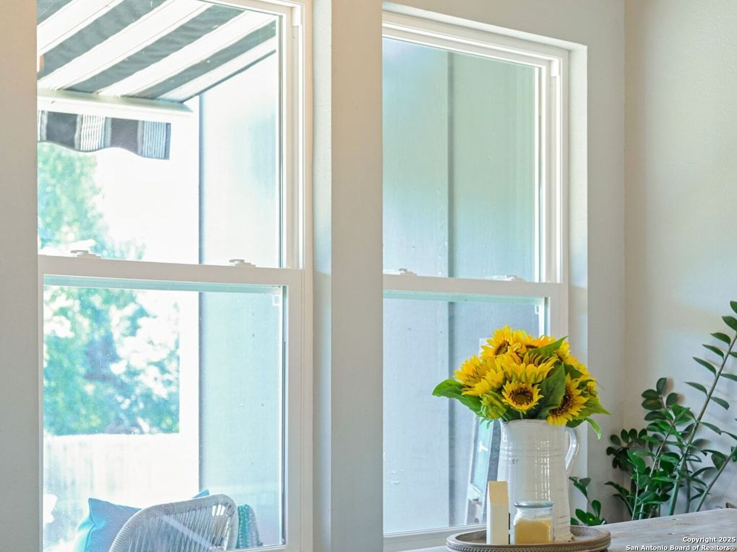 6766 Spring Branch Road Spring Branch, TX 78070 - Photo 29 of 63 a vase of flowers sitting on a table with a window