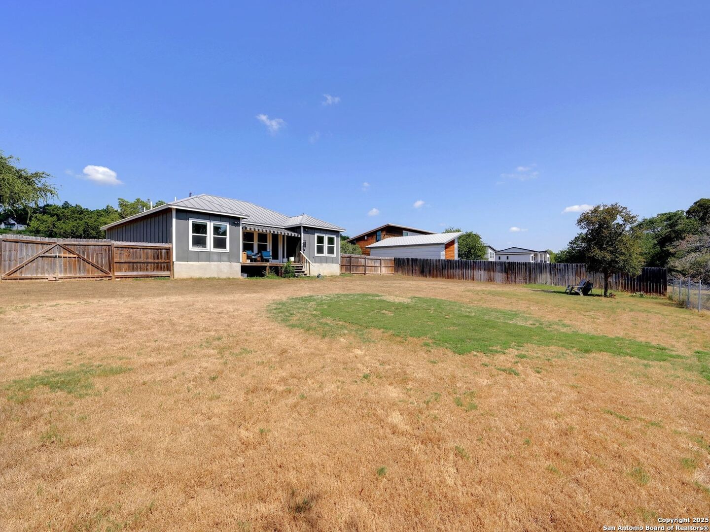 6766 Spring Branch Road Spring Branch, TX 78070 - Photo 34 of 63 a view of a house with yard and sitting area