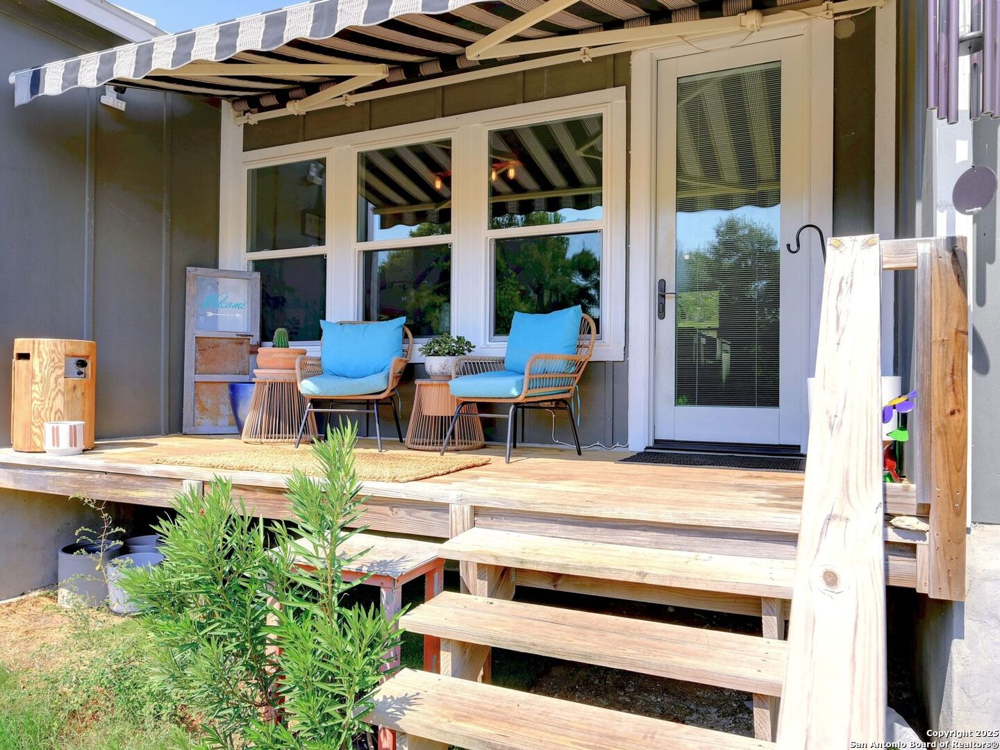 6766 Spring Branch Road Spring Branch, TX 78070 - Photo 37 of 63 a view of a patio with couches chairs and potted plants