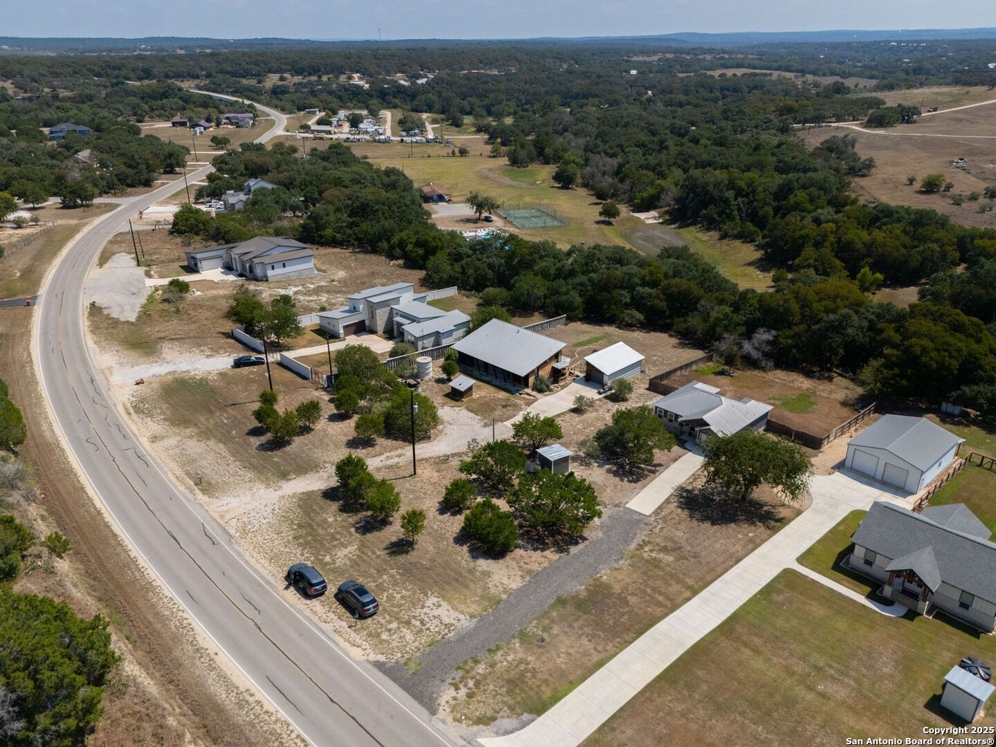 6766 Spring Branch Road Spring Branch, TX 78070 - Photo 56 of 63 an aerial view of a house with a garden