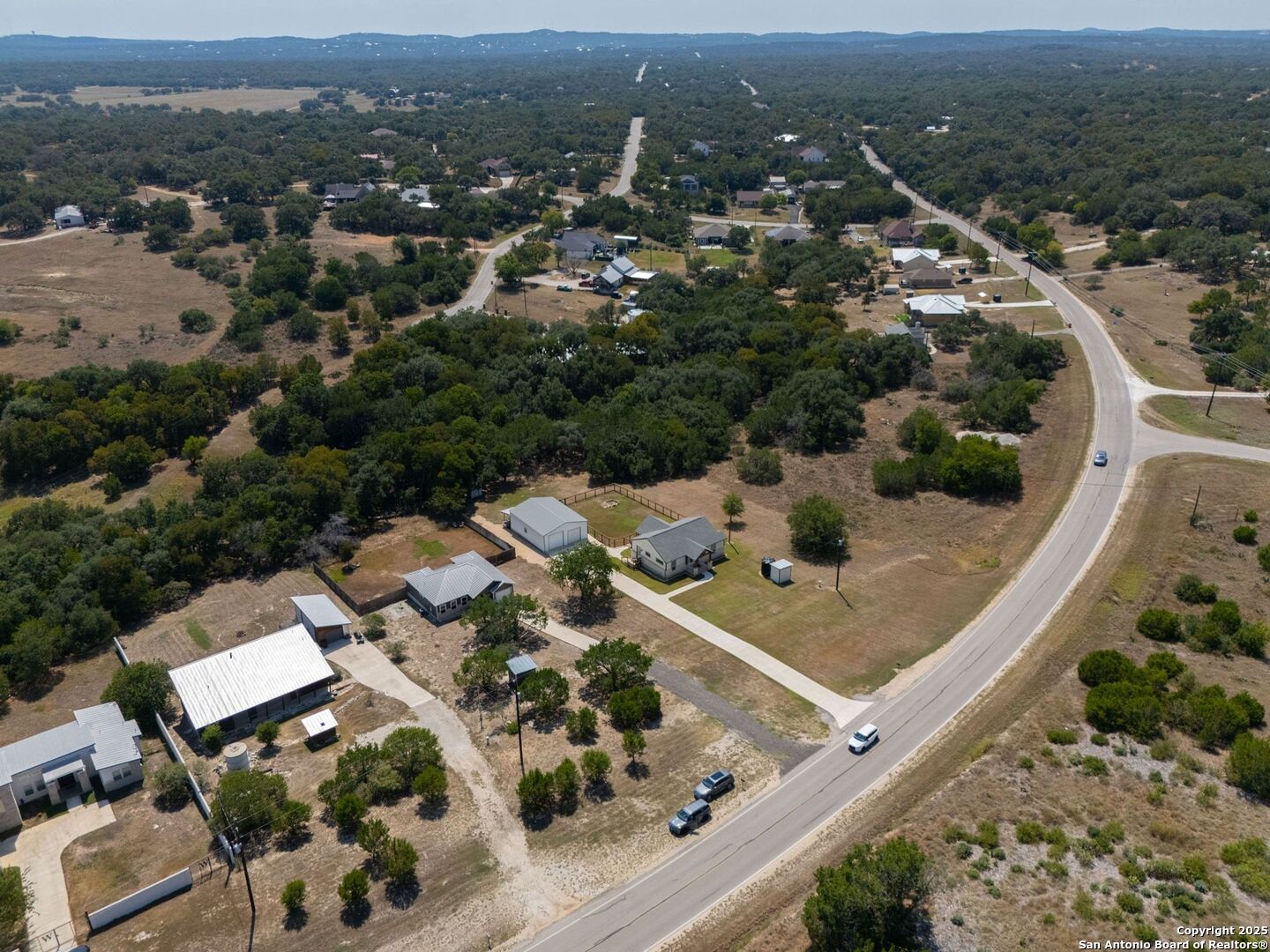 6766 Spring Branch Road Spring Branch, TX 78070 - Photo 57 of 63 an aerial view of residential houses with outdoor space