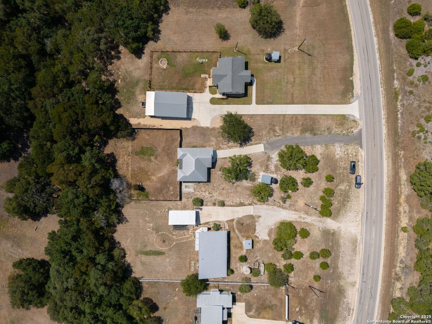 6766 Spring Branch Road Spring Branch, TX 78070 - Photo 58 of 63 an aerial view of residential houses with outdoor space