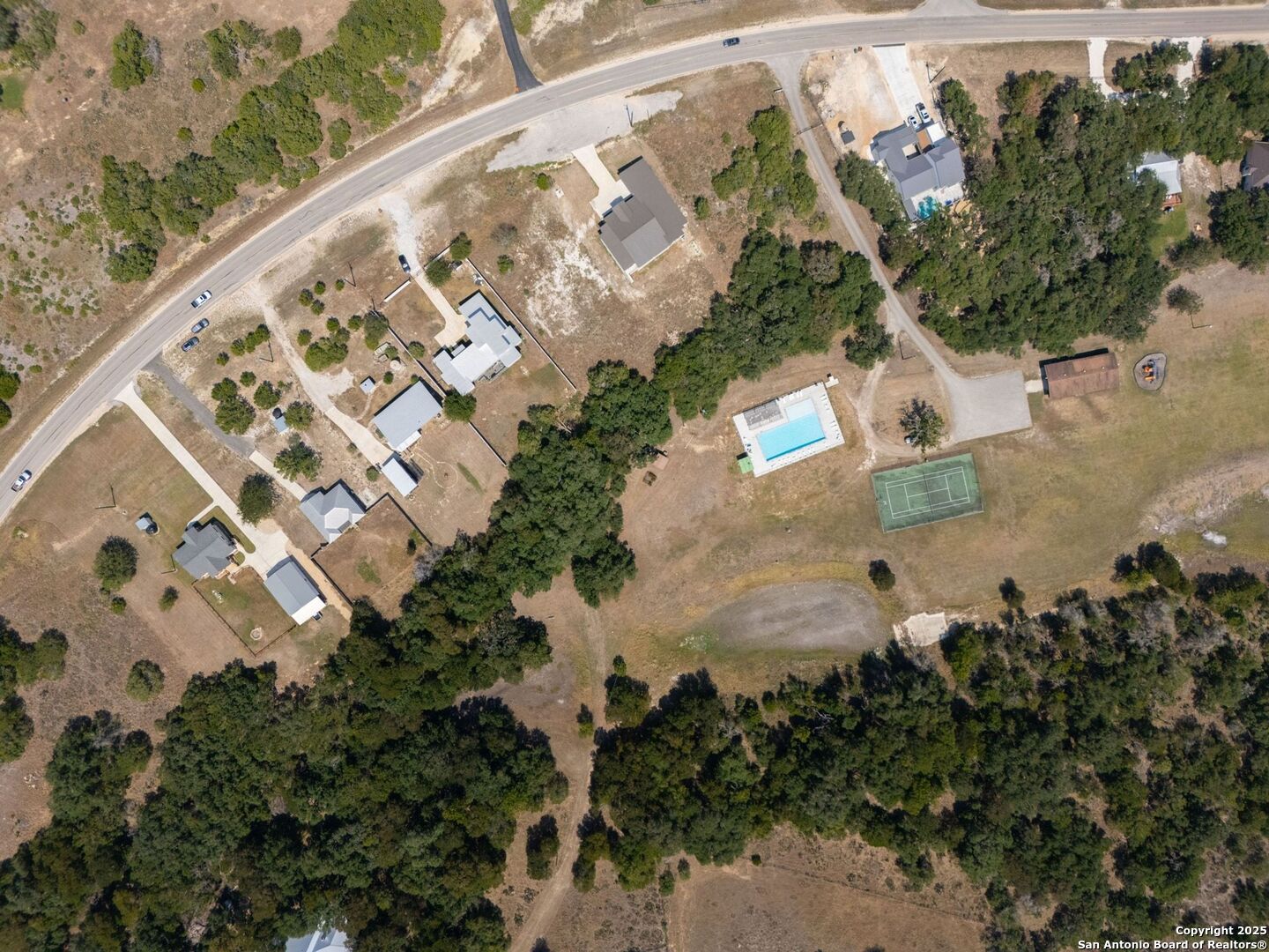 6766 Spring Branch Road Spring Branch, TX 78070 - Photo 60 of 63 an aerial view of residential houses with outdoor space