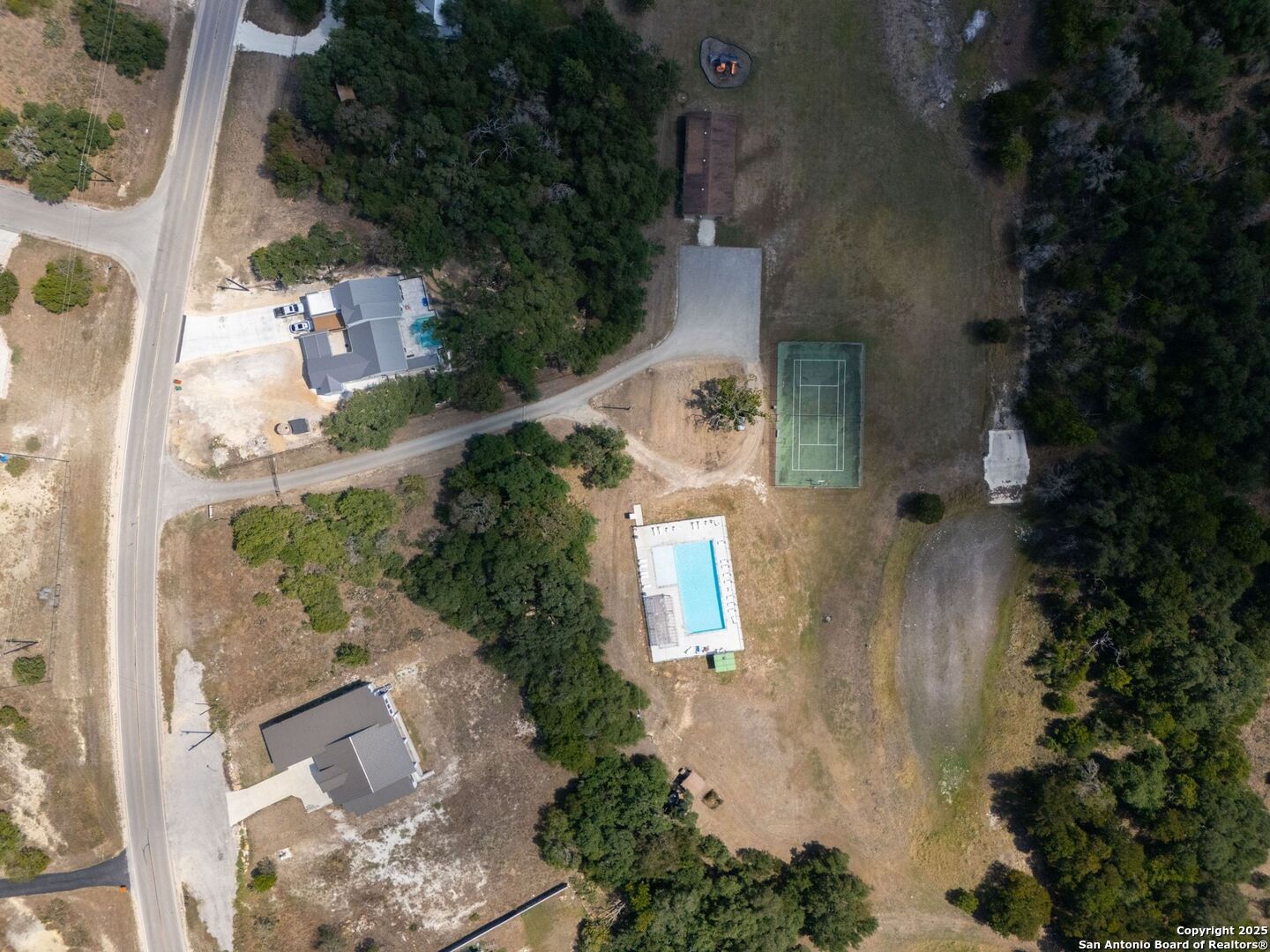 6766 Spring Branch Road Spring Branch, TX 78070 - Photo 63 of 63 an aerial view of a house with a yard