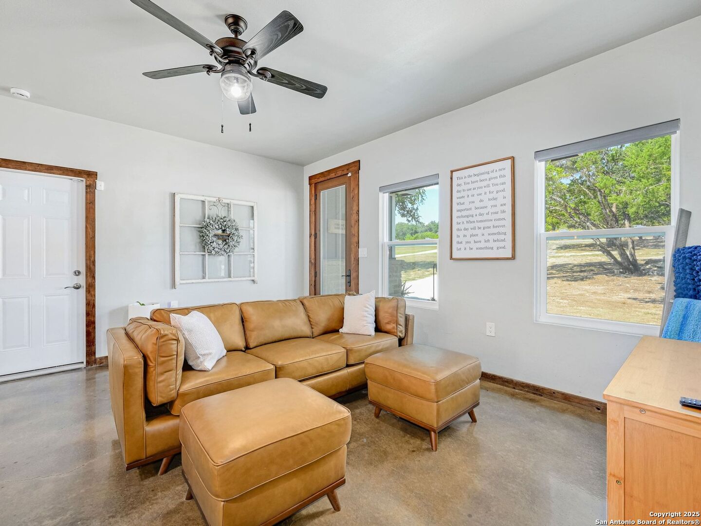 6766 Spring Branch Road Spring Branch, TX 78070 - Photo 7 of 63 a living room with furniture and a large window
