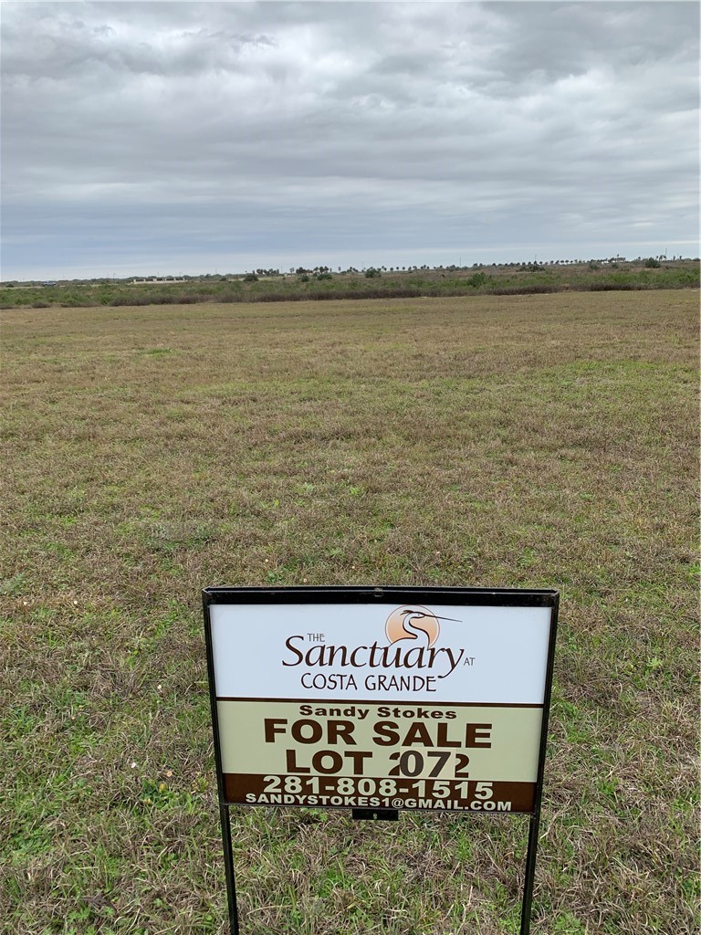 7 East Lago Loop Port O'Connor, TX 77982 - Photo 2 of 15 a sign board with an ocean view