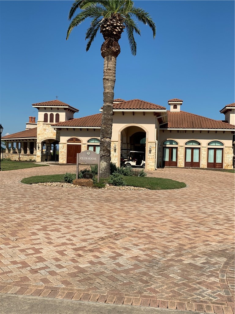 7 East Lago Loop Port O'Connor, TX 77982 - Photo 10 of 15 a front view of a building with garden