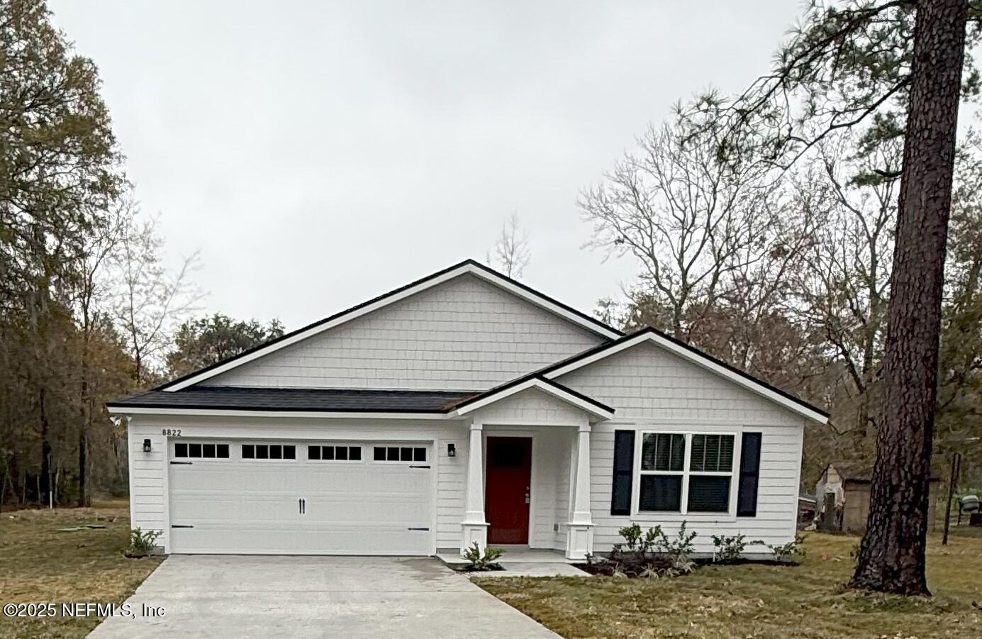 8822 Orme Road Jacksonville, FL 32220 - Photo 1 of 26 a front view of a house with a yard