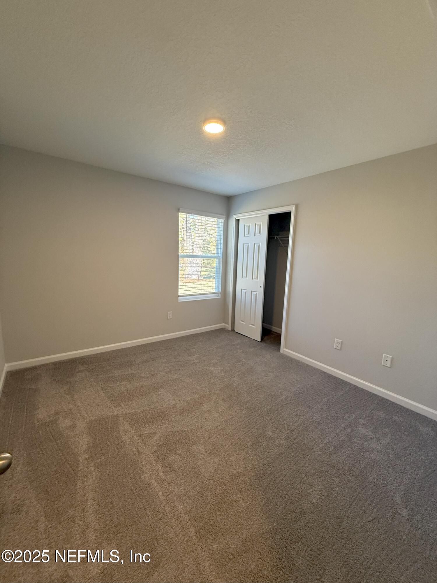 8822 Orme Road Jacksonville, FL 32220 - Photo 22 of 26 a view of an empty room with a window