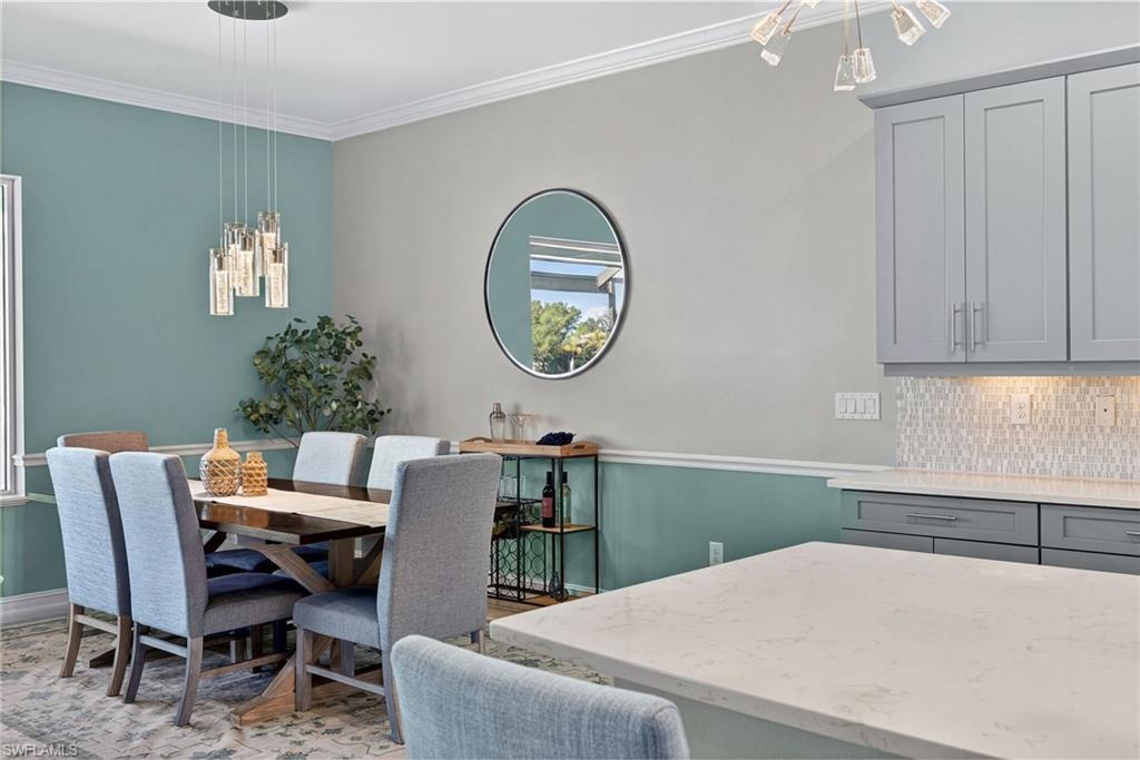 14748 Windward Lane Naples, FL 34114 - Photo 15 of 50 a view of a dining room with furniture