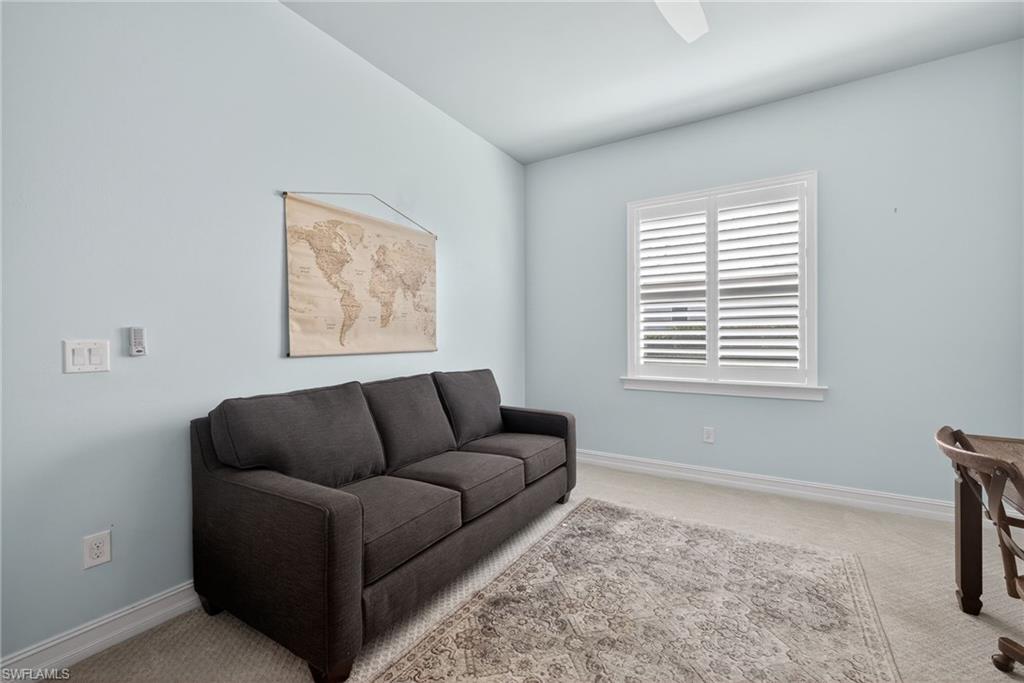 14748 Windward Lane Naples, FL 34114 - Photo 17 of 50 a living room with furniture and a window