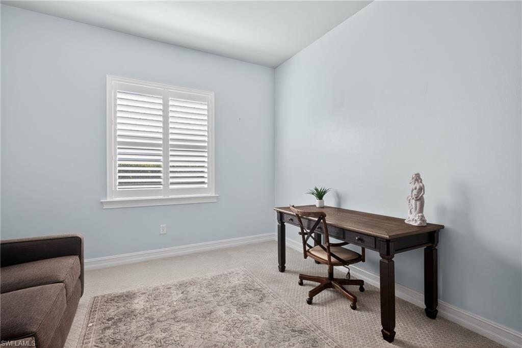 14748 Windward Lane Naples, FL 34114 - Photo 18 of 50 a view of a workspace with furniture and a window