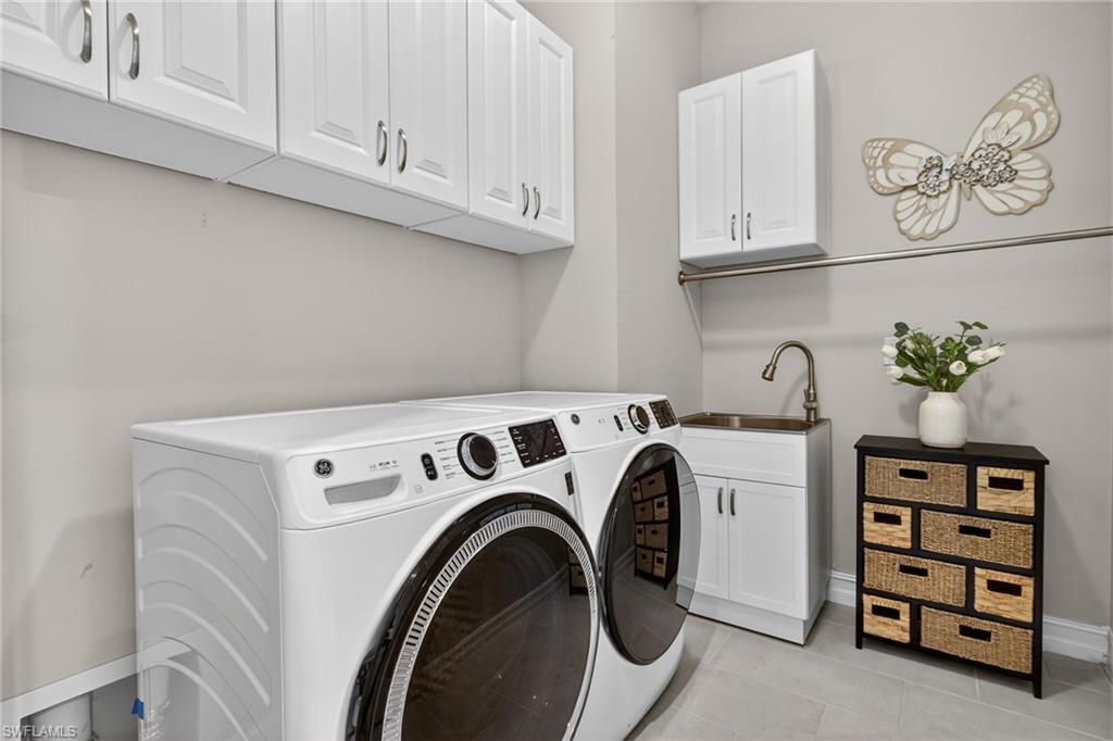 14748 Windward Lane Naples, FL 34114 - Photo 29 of 50 a utility room with dryer and washer