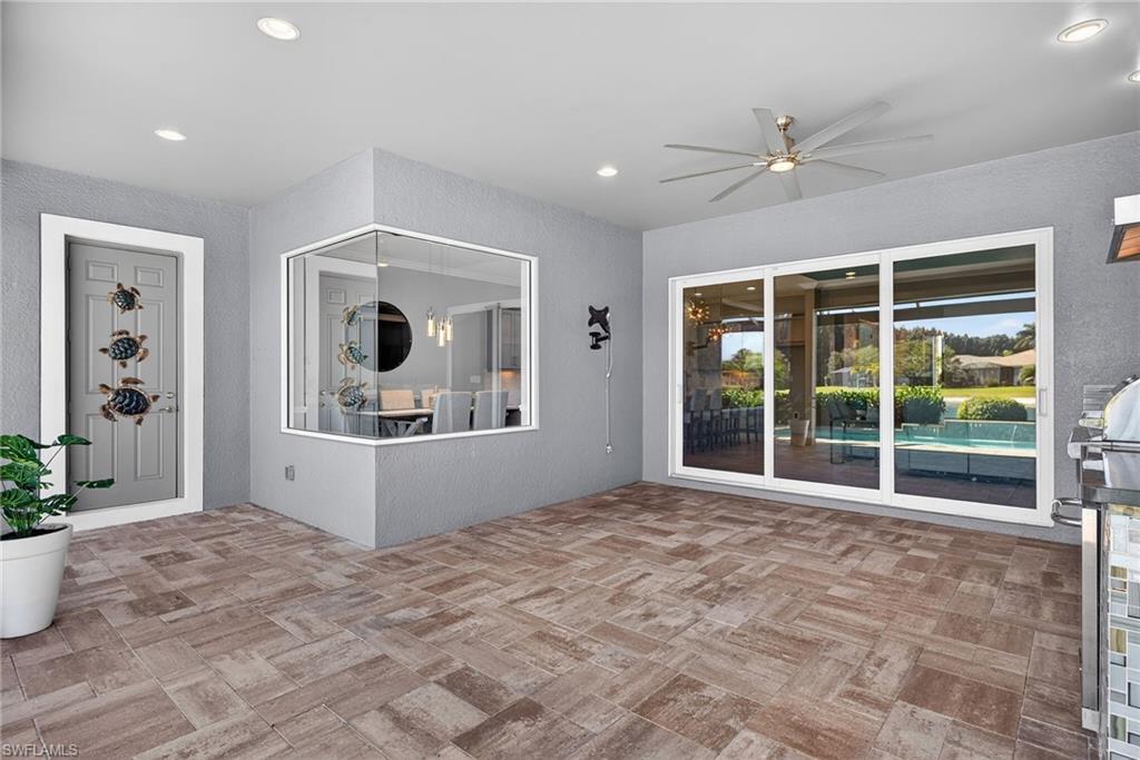 14748 Windward Lane Naples, FL 34114 - Photo 36 of 50 a view of an empty room with window and wooden floor