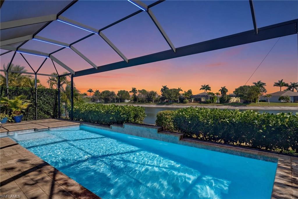 14748 Windward Lane Naples, FL 34114 - Photo 39 of 50 a view of a backyard with sitting area