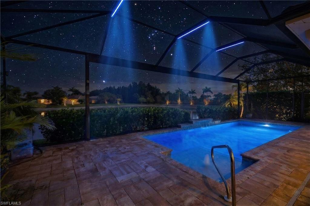 14748 Windward Lane Naples, FL 34114 - Photo 41 of 50 a view of a patio with table and chairs with potted plants