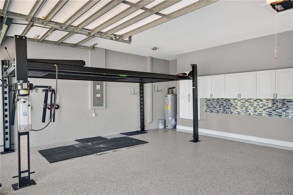 14748 Windward Lane Naples, FL 34114 - Photo 44 of 50 a view of a room with gym equipment