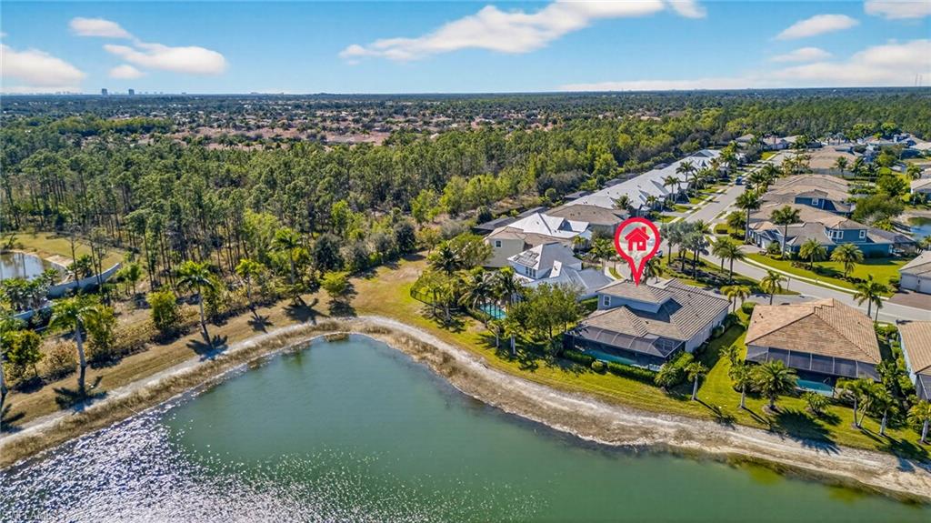 14748 Windward Lane Naples, FL 34114 - Photo 46 of 50 an aerial view of a house with a garden and lake view