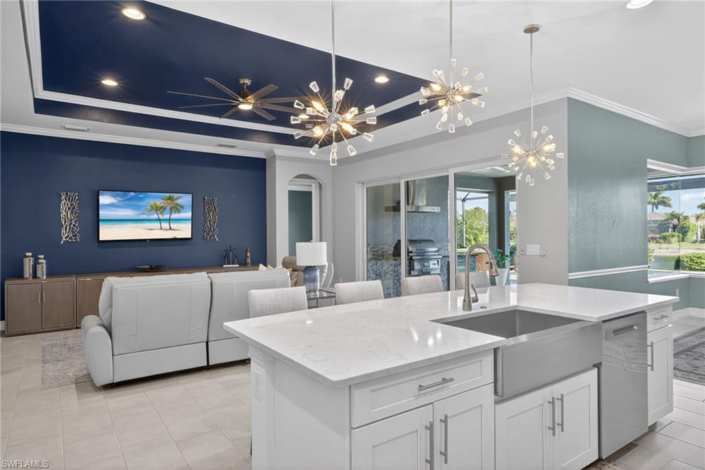 14748 Windward Lane Naples, FL 34114 - Photo 10 of 50 a view of living room kitchen with a chandelier furniture and a chandelier